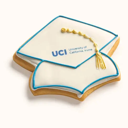Customizable graduation cap cookie featuring printed school logo and hand-piped tassel in team colors Blue