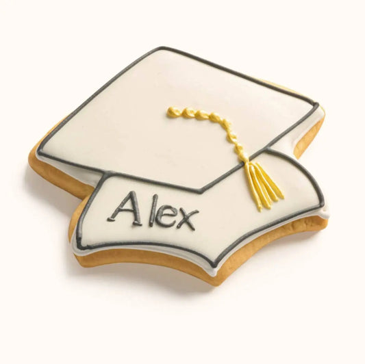 Personalized name graduation cap cookie with hand-piped metallic tassel, customizable school colors, and individual icing Brown