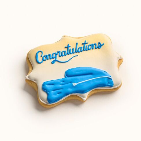 Customizable graduation gown cookie with hand-piped congratulations message, available in any school team colors Blue