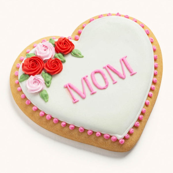 Heart-shaped sugar cookie for Mother's Day featuring hand-piped pink icing roses and a personalized name or message.