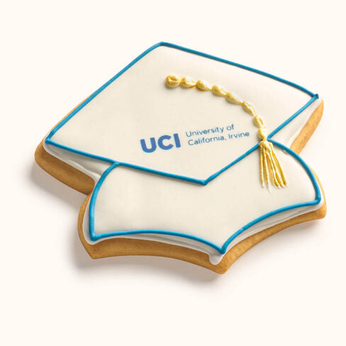 Customizable graduation cap cookie featuring printed school logo and hand-piped tassel in team colors Blue