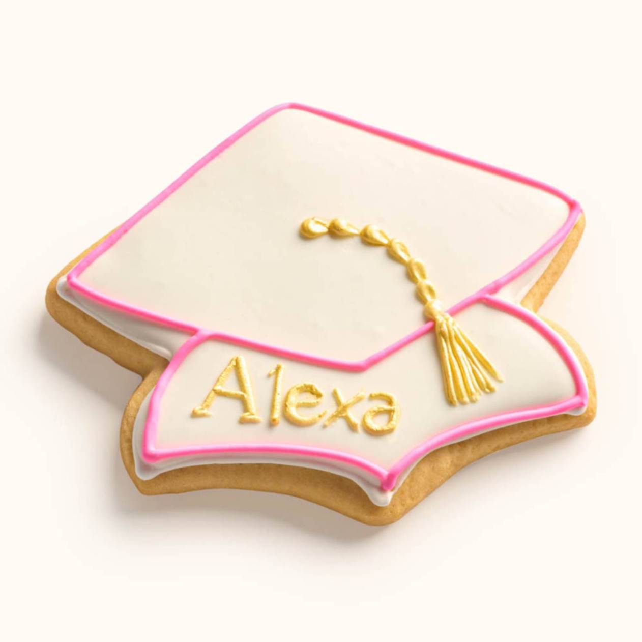 Personalized name graduation cap cookie with hand-piped metallic tassel, customizable school colors, and individual icing Pink