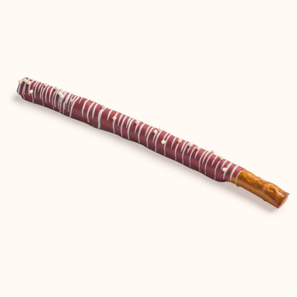 Customizable gourmet chocolate dipped pretzel rod with school color drizzle and decorative sprinkles for party favors.